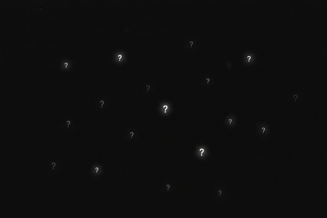 Black background with tiny faded question marks